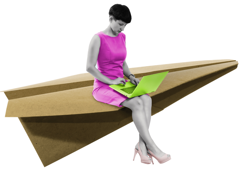 Woman on paper plane working with laptop