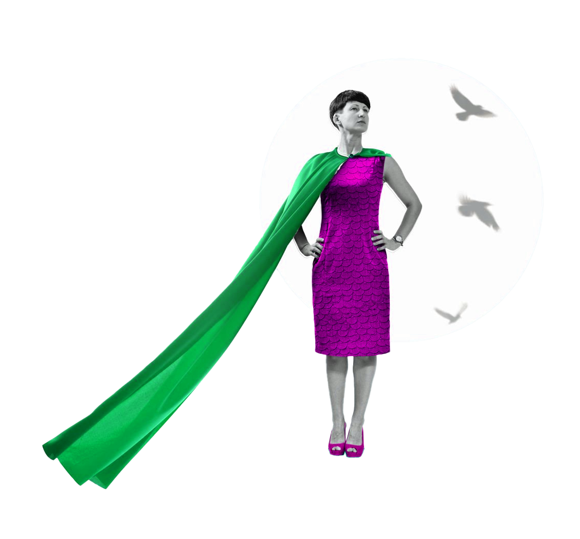 Woman with cape standing proud with her hands on hips