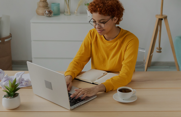 Woman in office with laptop