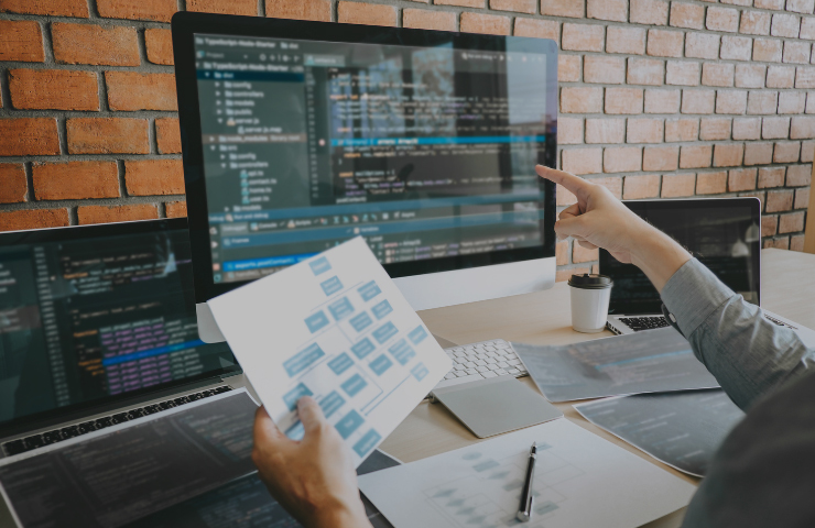 software developer working on iMac